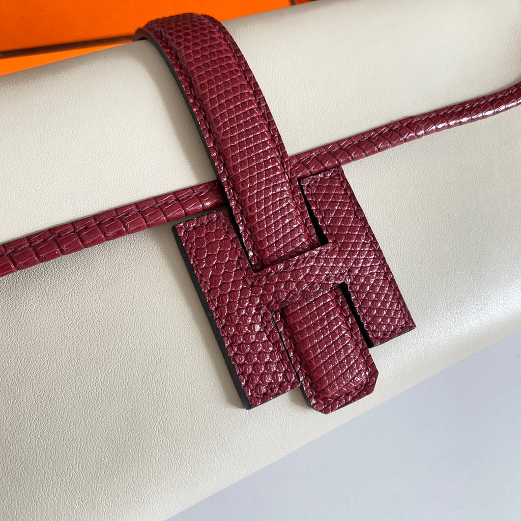 JIGE ELAN 29 CLUTCH IN WHITE CALFSKIN WITH GARNET RED LIZARD SKIN