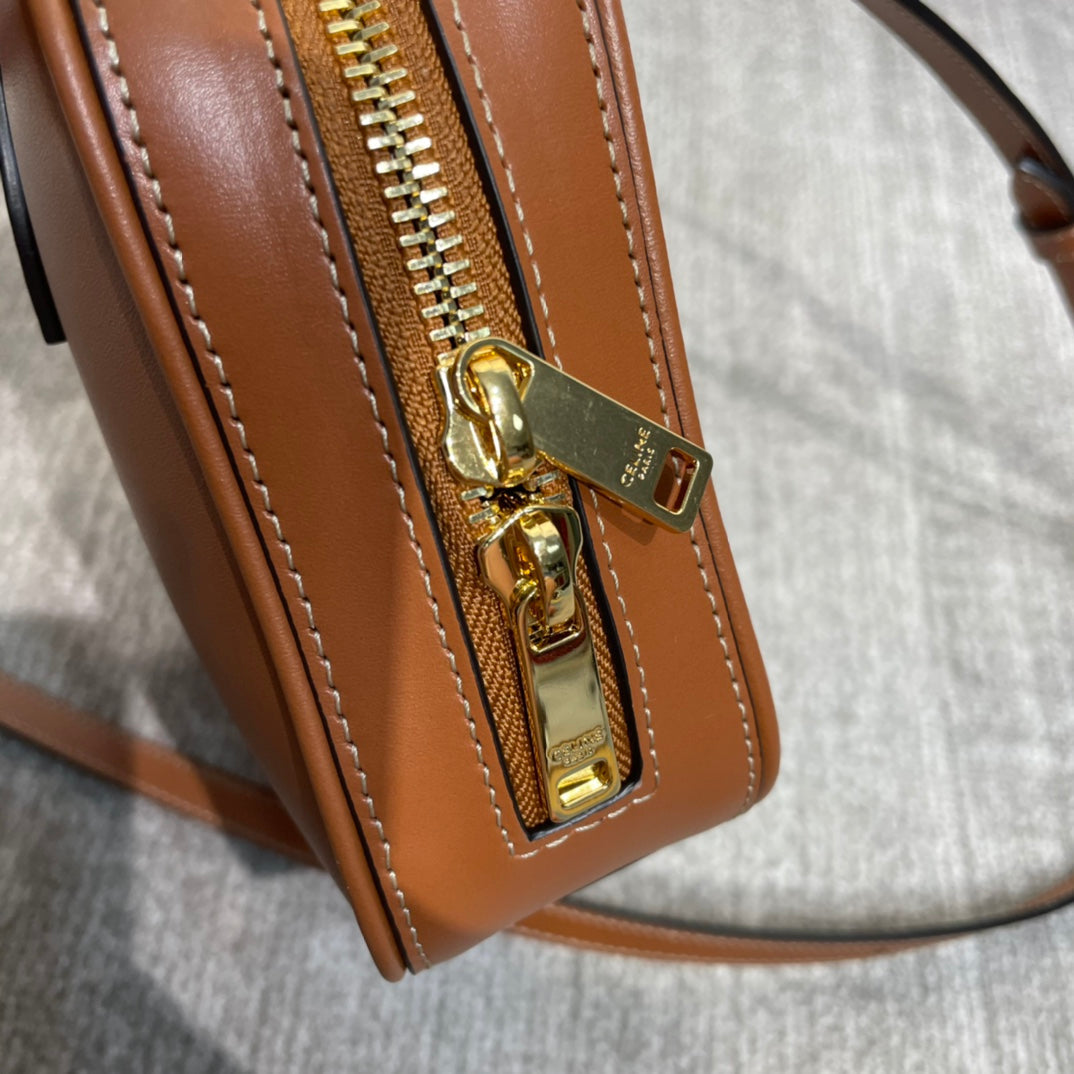 TRIOMPHE TOP HANDLE BAG 20 IN BRONZE BROWN CALFSKIN