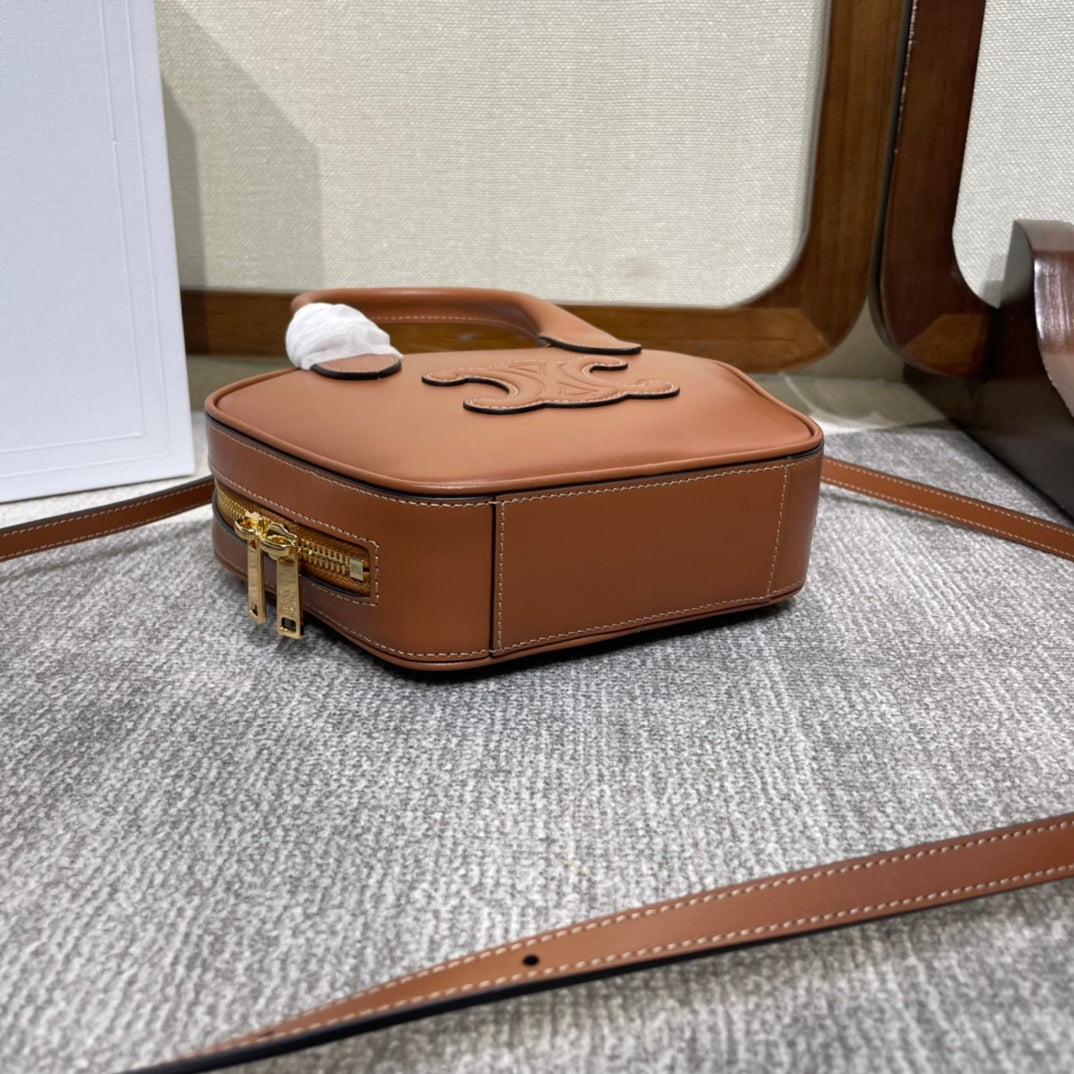TRIOMPHE TOP HANDLE BAG 20 IN BRONZE BROWN CALFSKIN