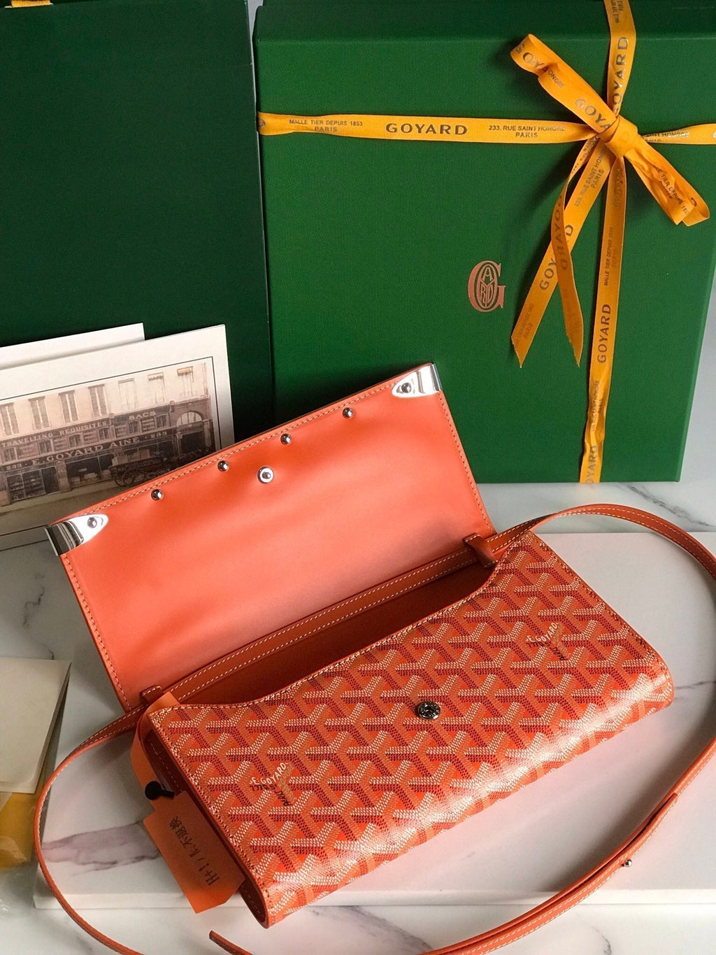 MONTE-CARLO PM CLUTCH 25 IN ORANGE GOYARDINE CANVAS