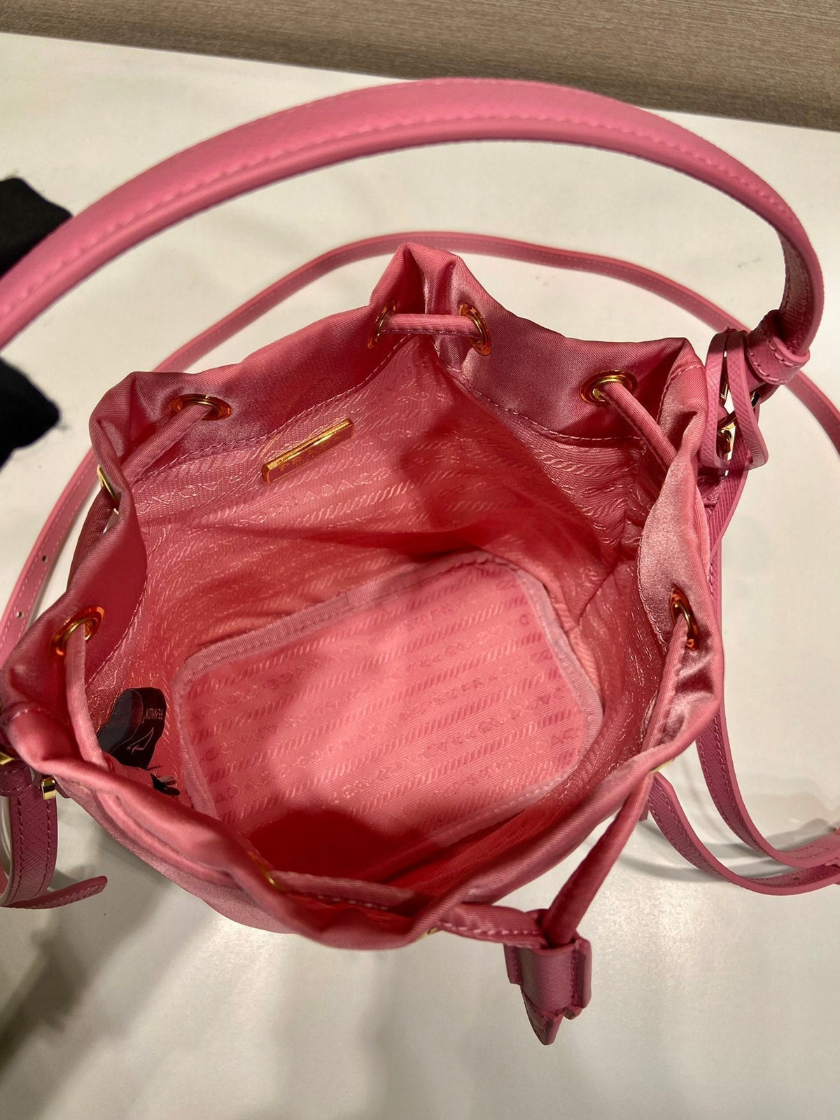 BUCKET BAG 19 IN CANDY PINK RE-NYLON AND SAFFIANO LEATHER HANDLE