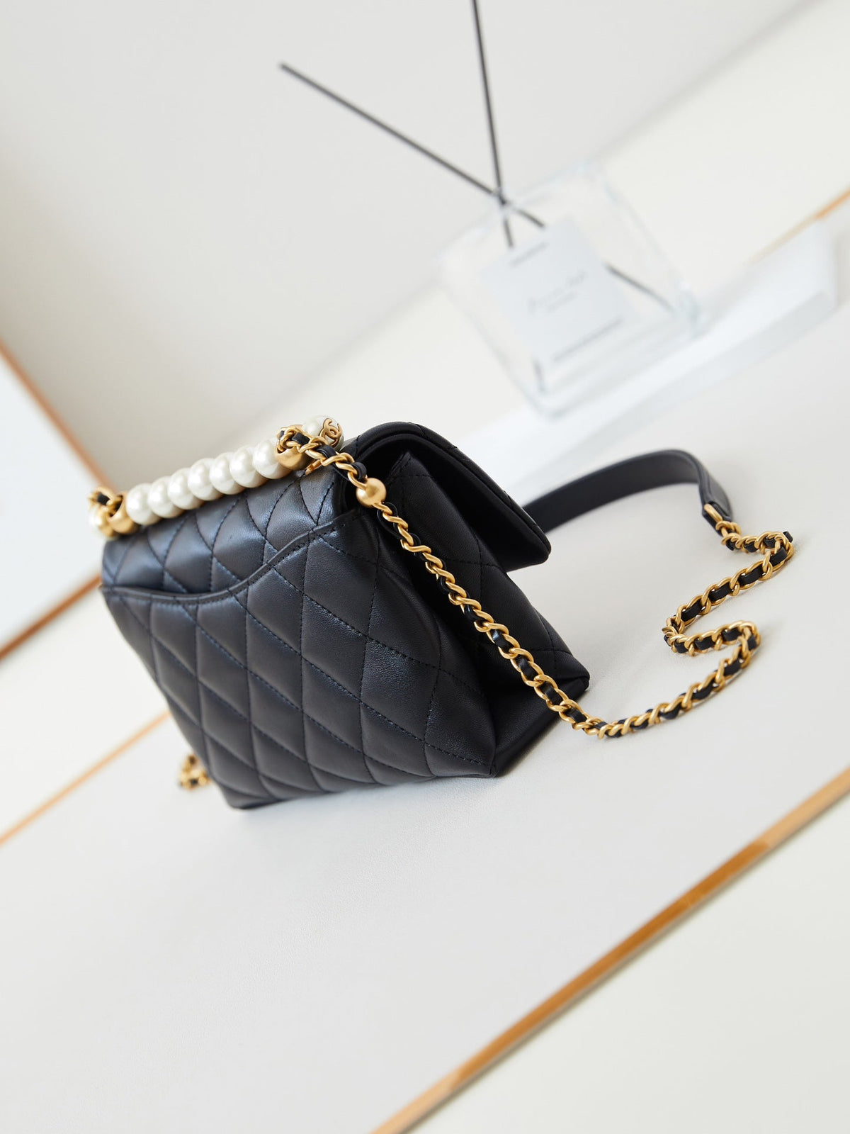 PEARL ATTACHED FLAP BAG 19 IN BLACK QUILTED LAMBSKIN GOLD HARDWARE
