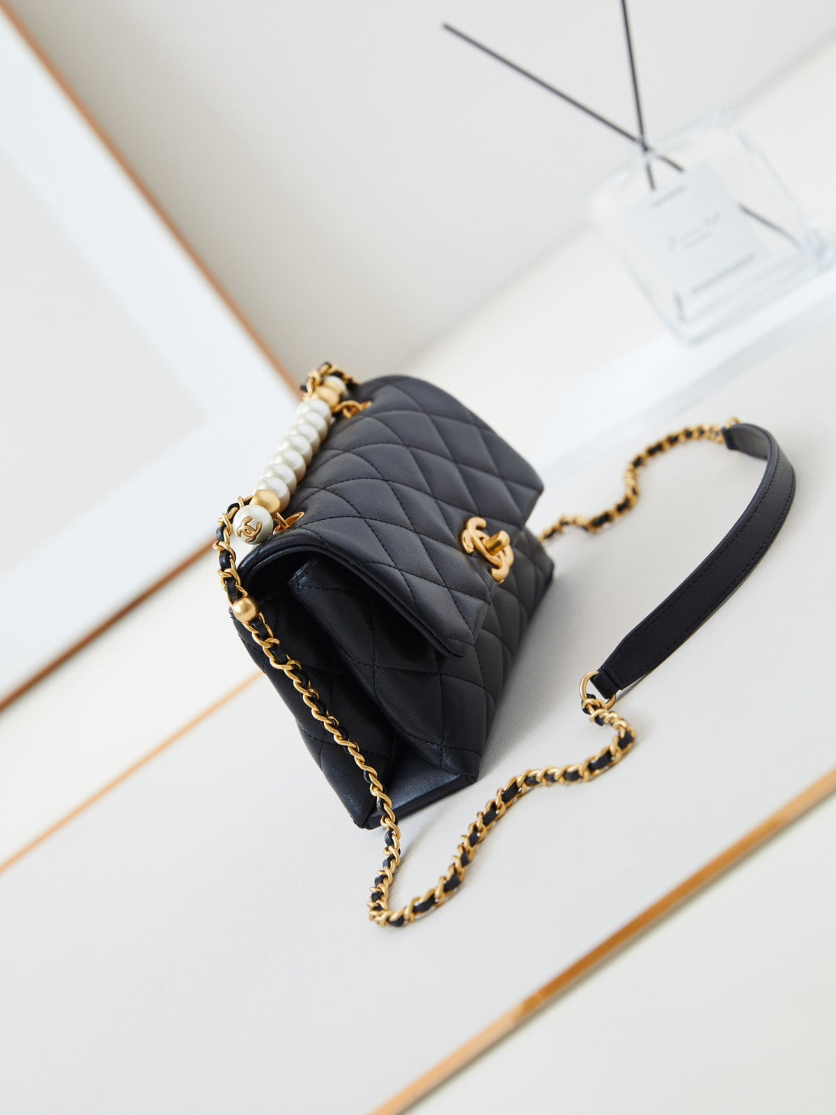 PEARL ATTACHED FLAP BAG 19 IN BLACK QUILTED LAMBSKIN GOLD HARDWARE