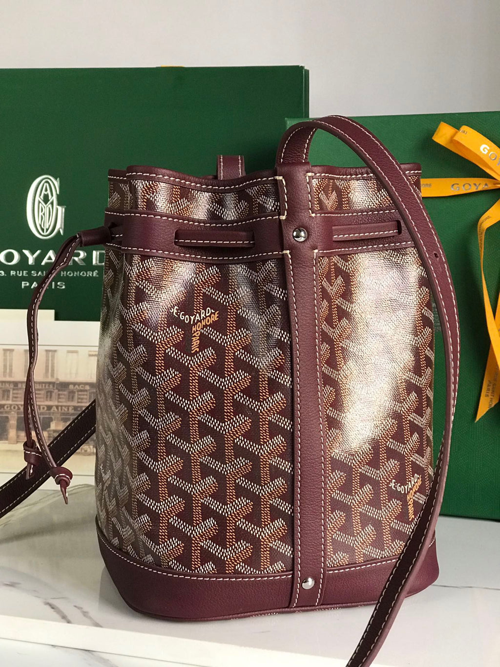 PETIT FLOT BUCKET BAG 22 IN WINE RED GOYARDINE CANVAS AND LAMBSKIN TRIM